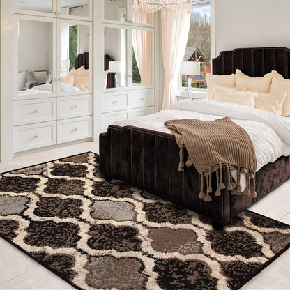 5' X 8' Brown Black And Ivory Quatrefoil Distressed Area Rug