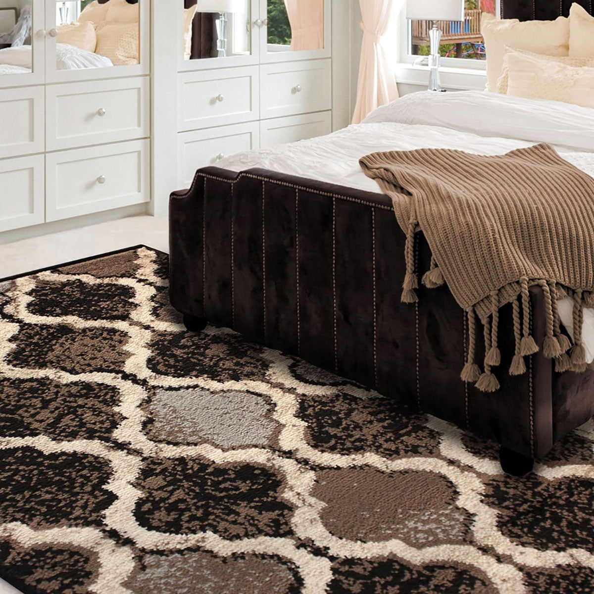 5' X 8' Brown Black And Ivory Quatrefoil Distressed Area Rug